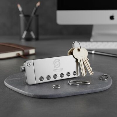 Prezzo buono Organizzatore per portachiavi in acciaio resistente con logo personalizzato Ideale per la custodia sicura delle chiavi e l'esposizione dell'identità aziendale in linea